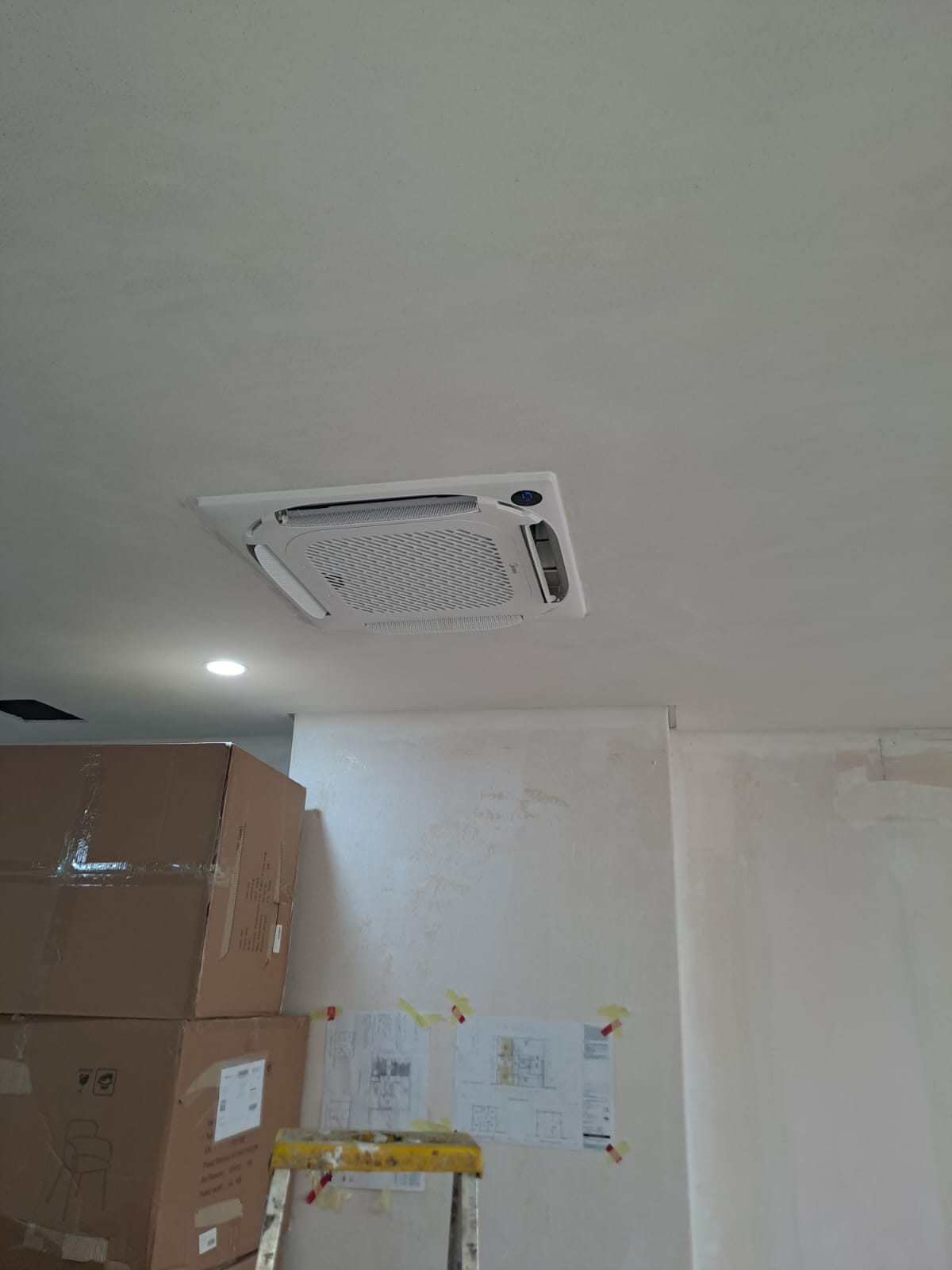 Ceiling cassette AC unit mounted in a newly renovated office space