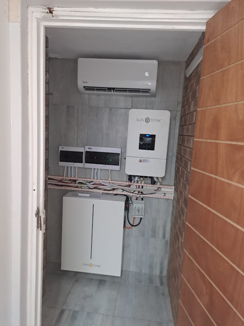 Midea wall split unit AC mounted in inverter and battery power room